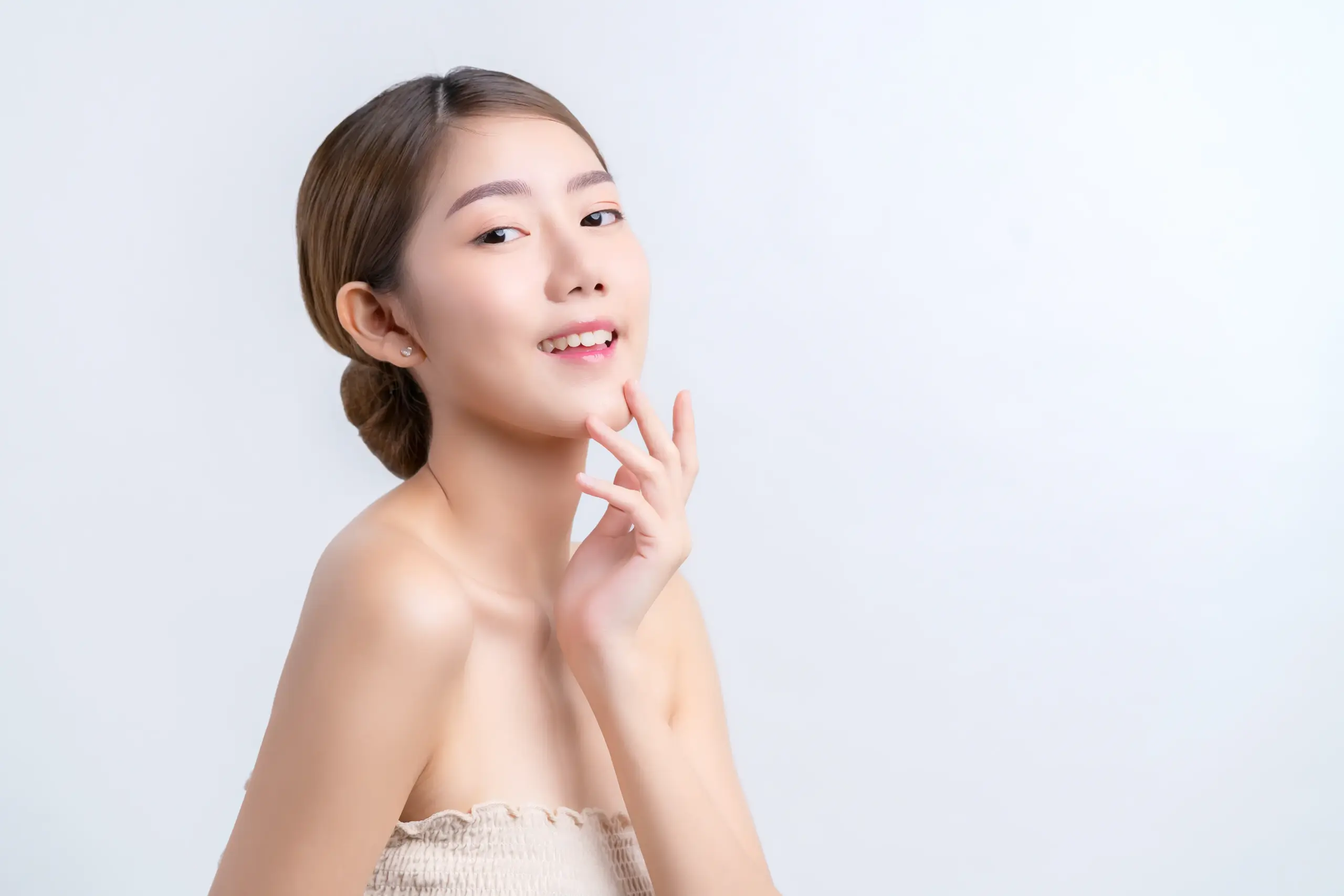 Skincare makeup concept beautiful asian female woman with healthy facial skin close up portrait studio shot